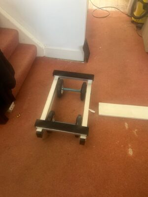Moving trolley positioned on an indoor staircase during an access check